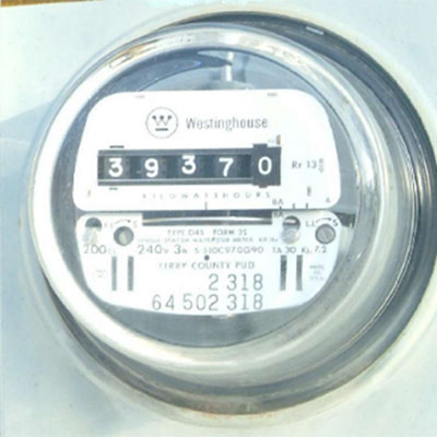 Older electric meter with an analog dial